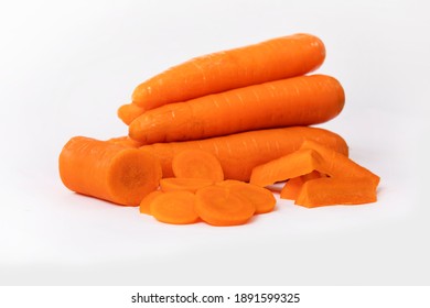 Whole Sliced Carrots On A White Background