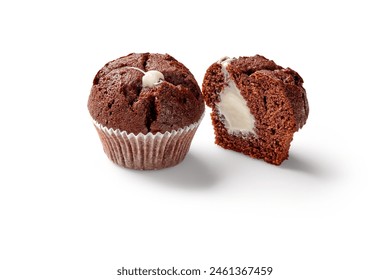 Whole and sliced chocolate muffins with creamy filling - Powered by Shutterstock