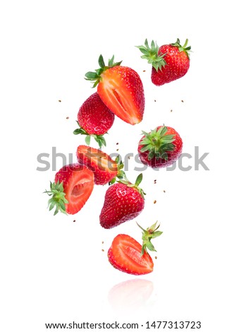 Whole and sliced fresh cherries in the air, isolated on a white background