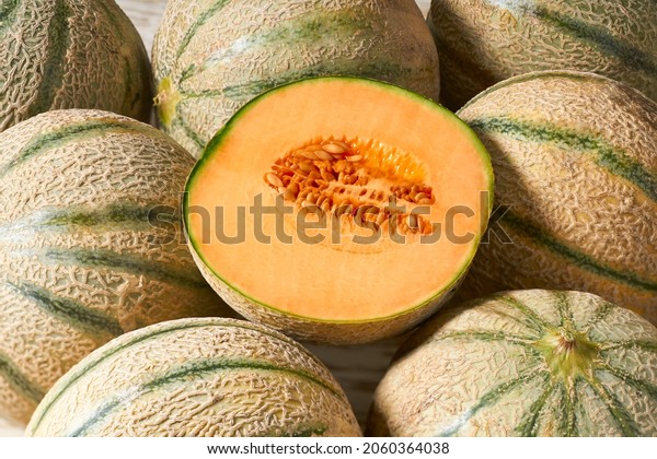 Whole and sliced ​​melon, honeydew melon or\
melon cantaloupe and food texture close up. Cantaloupe melon\
composition and design\
elements.