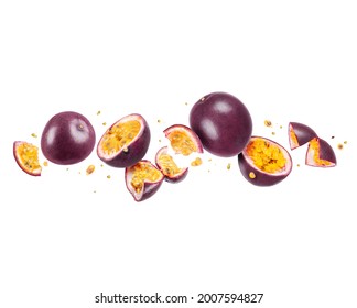 Whole and sliced passion fruit (passiflora) in the air on a white background - Shutterstock ID 2007594827