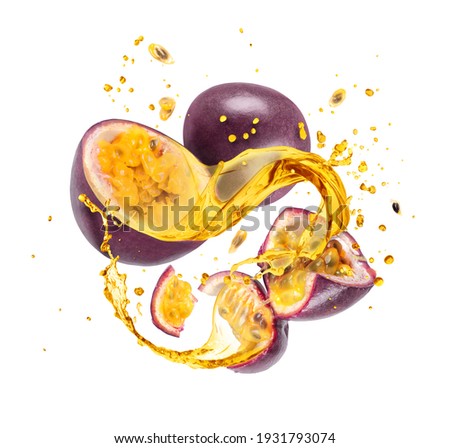 Whole and sliced passion fruit with splashes of juice, isolated on a white background
