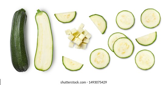 Whole and sliced zucchini isolated on white background. Top view.