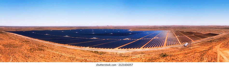 Whole Solar Power Generation Plant With Solar Panels On Red Soil Of Australian Outback At Broken HIll City In Aerial Panorama.