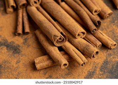 whole spice cinnamon and powdered cinnamon , whole shelf and ground cinnamon on the table