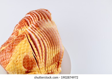 Whole Spiral Sliced Hickory Smoked Pork Ham Isolated On White Background.