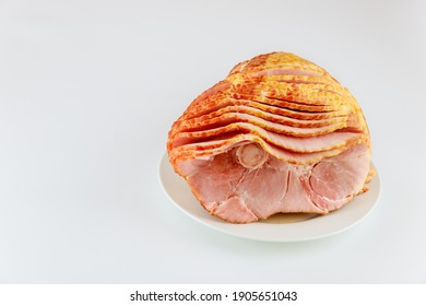 Whole Spiral Sliced Hickory Smoked Pork Ham Isolated On White Background.