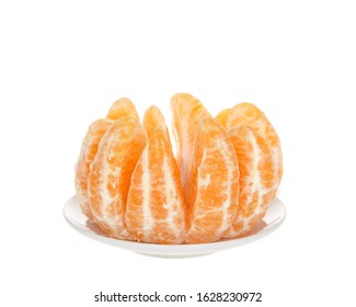 Whole Sumo Orange Peeled And Separated Sitting On Small Round Plate Isolated. Native To Japan, Sumo Oranges Are A Hybrid Citrus Fruit That's A Cross Between Mandarin And A California Naval Orange