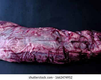 Whole Trimmed Beef Tenderloin In Plastic Package.Shot From Above