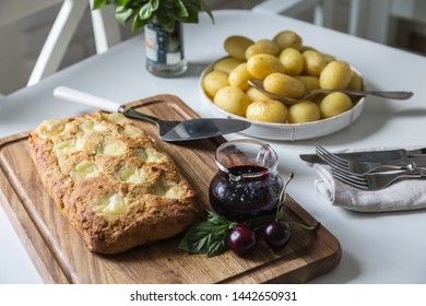 The Whole Veal Meatloaf With Mozzarella, Berry Sauce And Baby Potatoes In Caramel Dressing On White Kitchen.