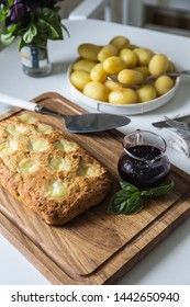 The Whole Veal Meatloaf With Mozzarella, Berry Sauce And Baby Potatoes In Caramel Dressing On White Kitchen.