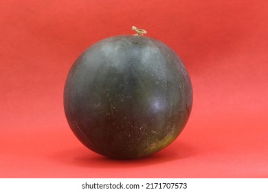 Whole Watermelon Isolated On Red Background