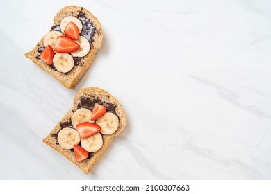 Whole Wheat Bread Toasted With Fresh Banana, Strawberry And Chocolate For Breakfast