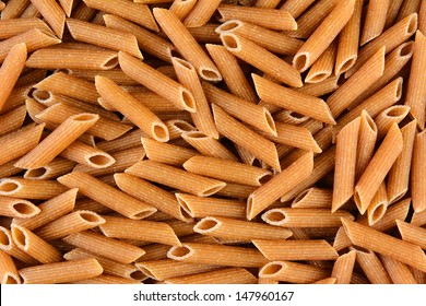 Whole Wheat Penne Rigate Closeup. 