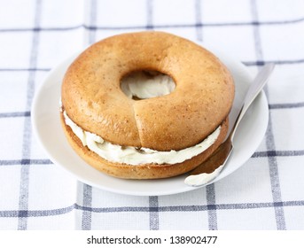 Whole Wheat Toasted Bagel With Cream Cheese. Breakfast Bagel.