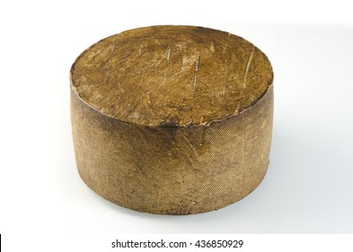 Whole Wheel Of Sheep Milk Cheese Over White Background.