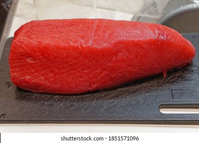 Whole Yellowfin Tuna Loin At Cutting Board