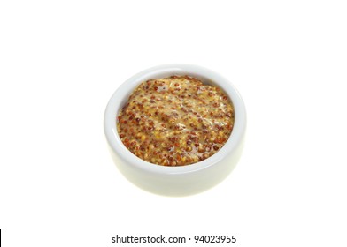 Wholegrain Mustard In A Ramekin Isolated Against White