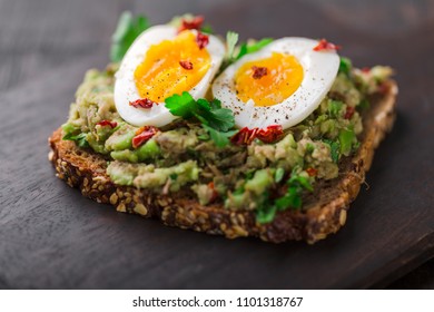 Wholegrain Toast Bread With Guacamole And Boiled Egg.