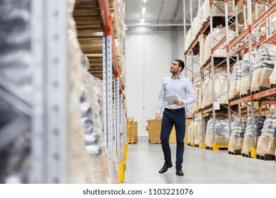 Wholesale, Logistic Business, Export And People Concept - Happy Businessman With Tablet Pc Computer Checking Goods At Warehouse