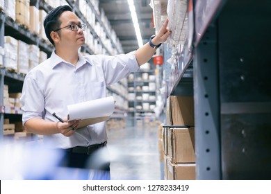 Wholesale, logistic, business, export and people concept - Man warehouse worker checking goods at warehouse. 