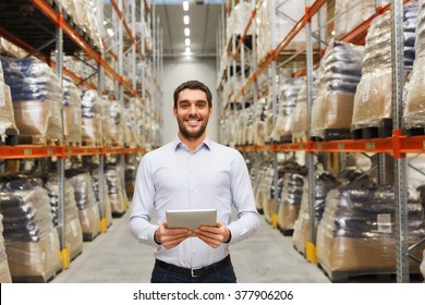 Wholesale, Logistic, Business, Export And People Concept - Happy Man Or Manager With Tablet Pc Computer At Warehouse