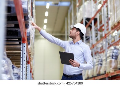 Wholesale, Logistic, Business, Export And People Concept - Happy Man Or Manager With Clipboard Checking Goods At Warehouse