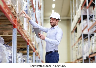 Wholesale, Logistic, Business, Export And People Concept - Happy Man Or Manager With Tablet Pc Computer Checking Goods At Warehouse