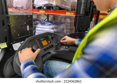 wholesale, logistic, loading, shipment and people concept - close up of man or worker operating forklift loader at warehouse - Powered by Shutterstock