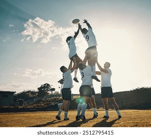 Whose ball is it. Full length shot of two handsome young rugby players catching the ball during a lineout on the field. - Powered by Shutterstock