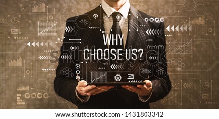 Why choose us with businessman holding a tablet computer on a dark vintage background