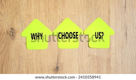 Why choose us symbol. Concept word Why choose us on beautiful yellow paper house. Beautiful wooden table wooden background. Business motivational why choose us concept. Copy space.