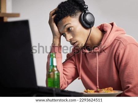 Why does this game keep lagging. Shot of a young man looking upset while playing video games at home.