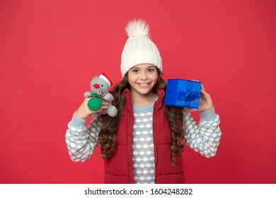 Why Not. Cute Little Girl Hold Mouse Toy. Child Knitted Winter Clothes Play With Toy Rat. Toy Shop For Kids. Christmas Gifts Online. In Xmas Mood. Happy New 2020 Year. Mouse Symbol Of The Year.