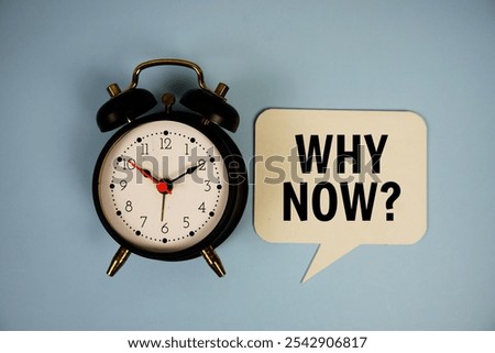 Why now? text on speech bubble with alarm clock top view on blue background