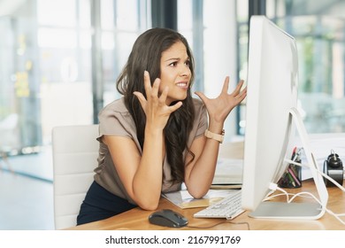 Why is this happening now. Shot of a frustrated businesswoman looking at her computer in dismay. - Shutterstock ID 2167991769