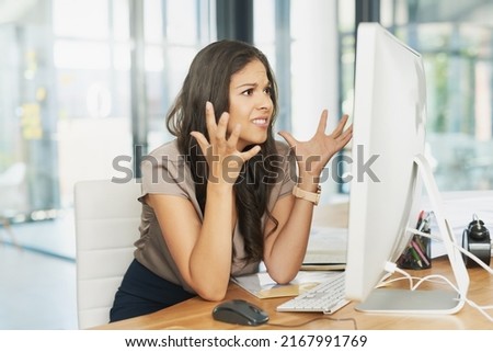 Why is this happening now. Shot of a frustrated businesswoman looking at her computer in dismay.