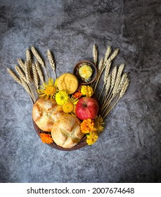 Wiccan Altar For Lammas, Lughnasadh Pagan Holiday. Ears Of Wheat, Homemade Bread, Flowers, Apple, Candle On Dark Background. Symbol Of Celtic Wiccan Sabbath, Summer Season. Flat Lay 