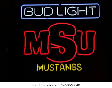 Wichita Falls, TX - February 7, 2020: Neon Sign On Building Advertising Beer Served In Restaurant And Local College Sports Team, MSU Midwestern State University Mustangs