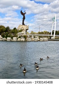 Wichita, Kansas - 2020: The Keeper Of The Plains Is A 44-foot, 5-ton Weathered Steel Sculpture By Kiowa-Comanche Artist Blackbear Bosin At The Confluence Of The Arkansas And Little Arkansas Rivers.