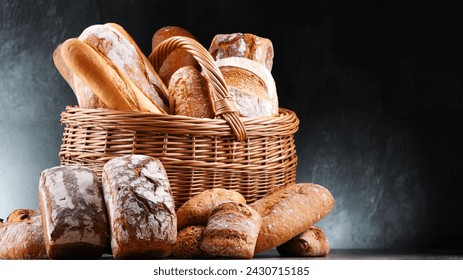 Wicker basket with assorted bakery products including loafs of bread and rolls - Powered by Shutterstock