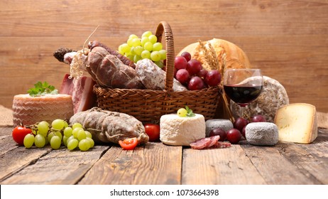 Wicker Basket With Cheese And Charcuterie