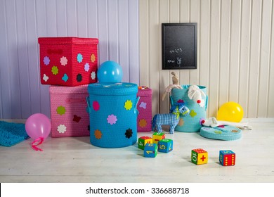 Wicker Basket Of Colored Storage And Toys