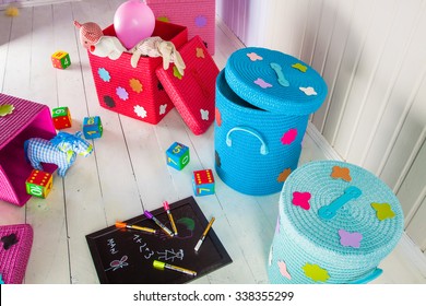 Wicker Basket Of Colored Storage And Toys