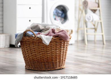 Wicker Basket With Dirty Laundry On Floor Indoors, Space For Text