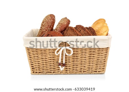 Wicker basket with fresh bread on white background