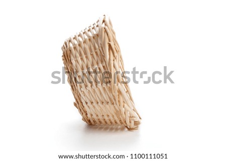 A wicker basket isolated on white background