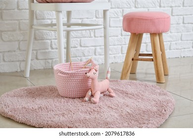 Wicker basket and kid toy in room - Powered by Shutterstock