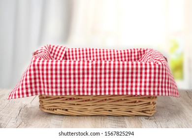 Wicker basket on a wooden table - Powered by Shutterstock