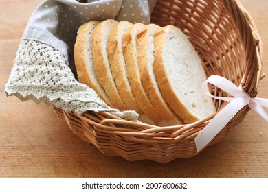 A wicker basket with sliced bread. 